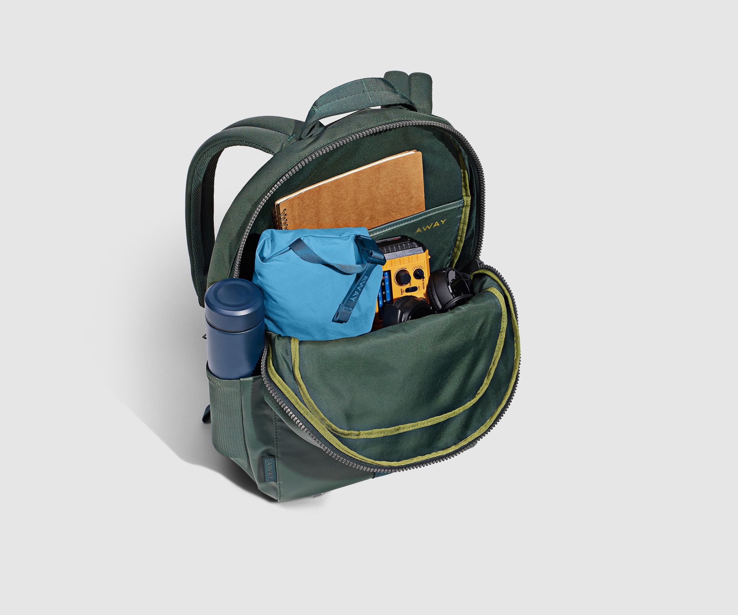 PDP_OutdoorBackpack26L_CoreGreen_BackPocketPacked.jpg